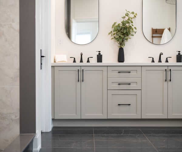 Modern bathroom vanity with two sinks and mirrors